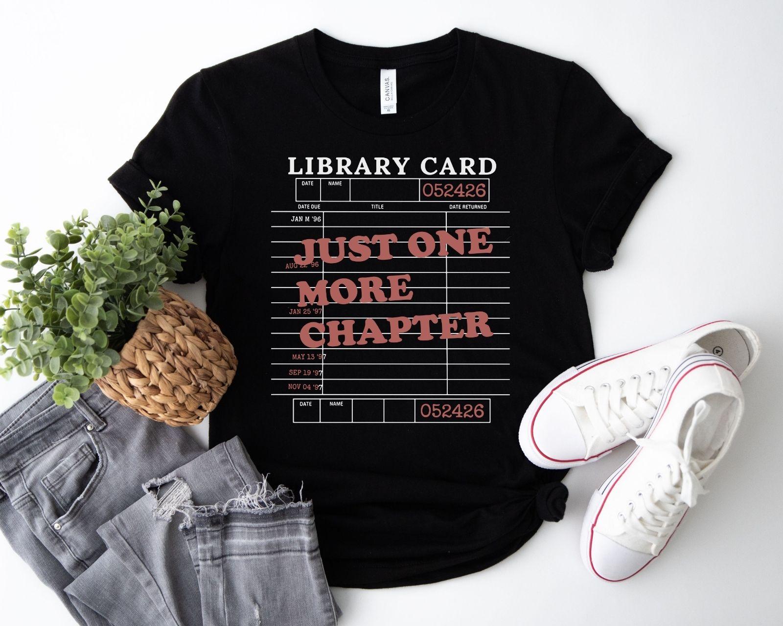 A bella canvas 3001 shirt with the saying "Just one more chapter"