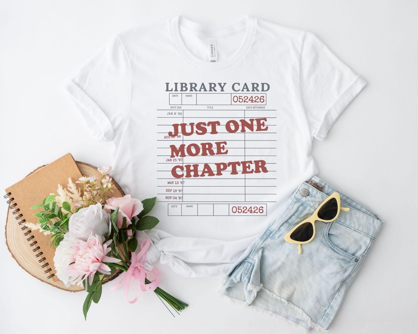 A bella canvas 3001 shirt with the saying "Just one more chapter"