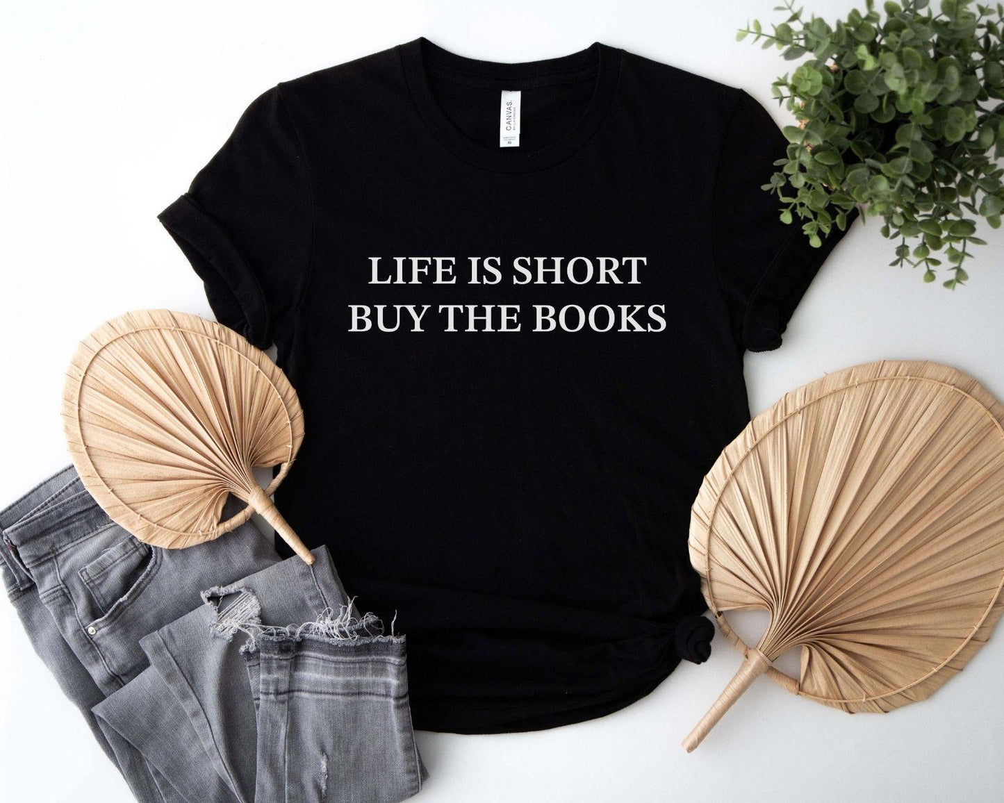A comfort colors® shirt with the saying "life is short buy the books"