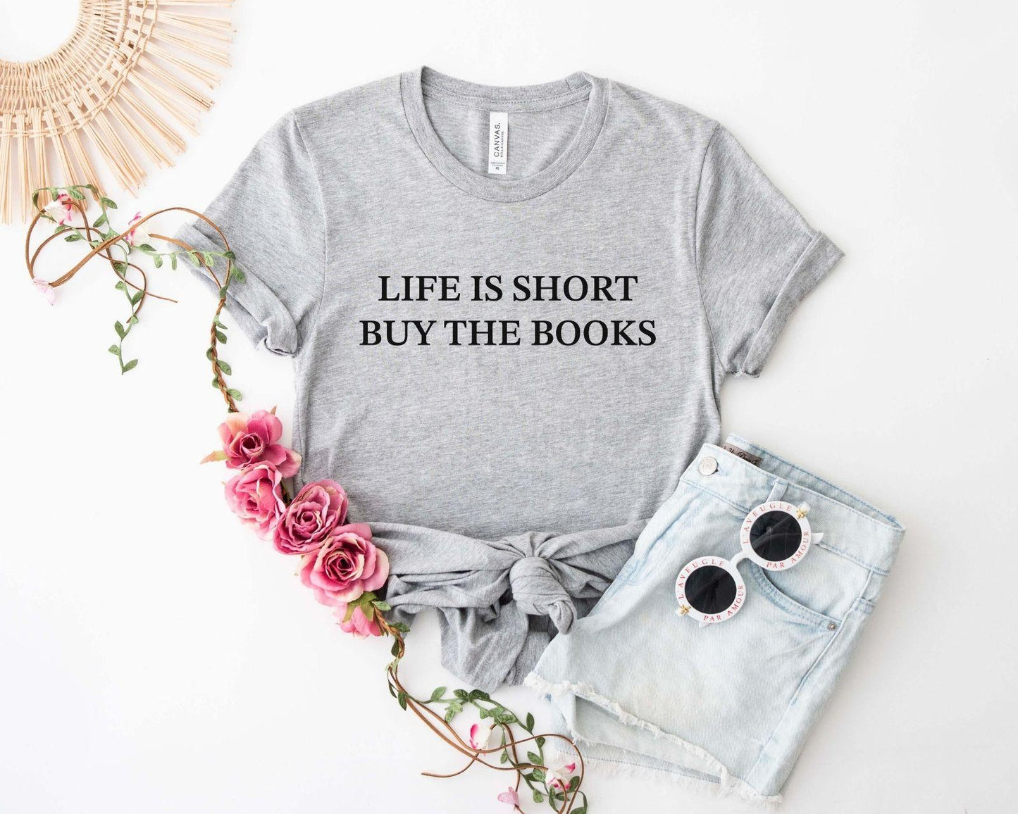 A comfort colors® shirt with the saying "life is short buy the books"