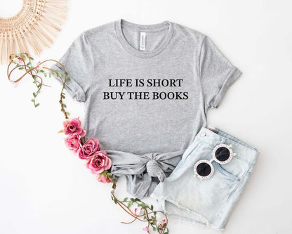 A comfort colors® shirt with the saying "life is short buy the books"