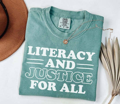 A comfort colors® shirt with the saying "Literacy and justice for all"