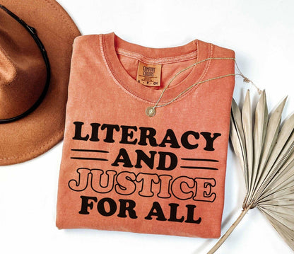 A comfort colors® shirt with the saying "Literacy and justice for all"