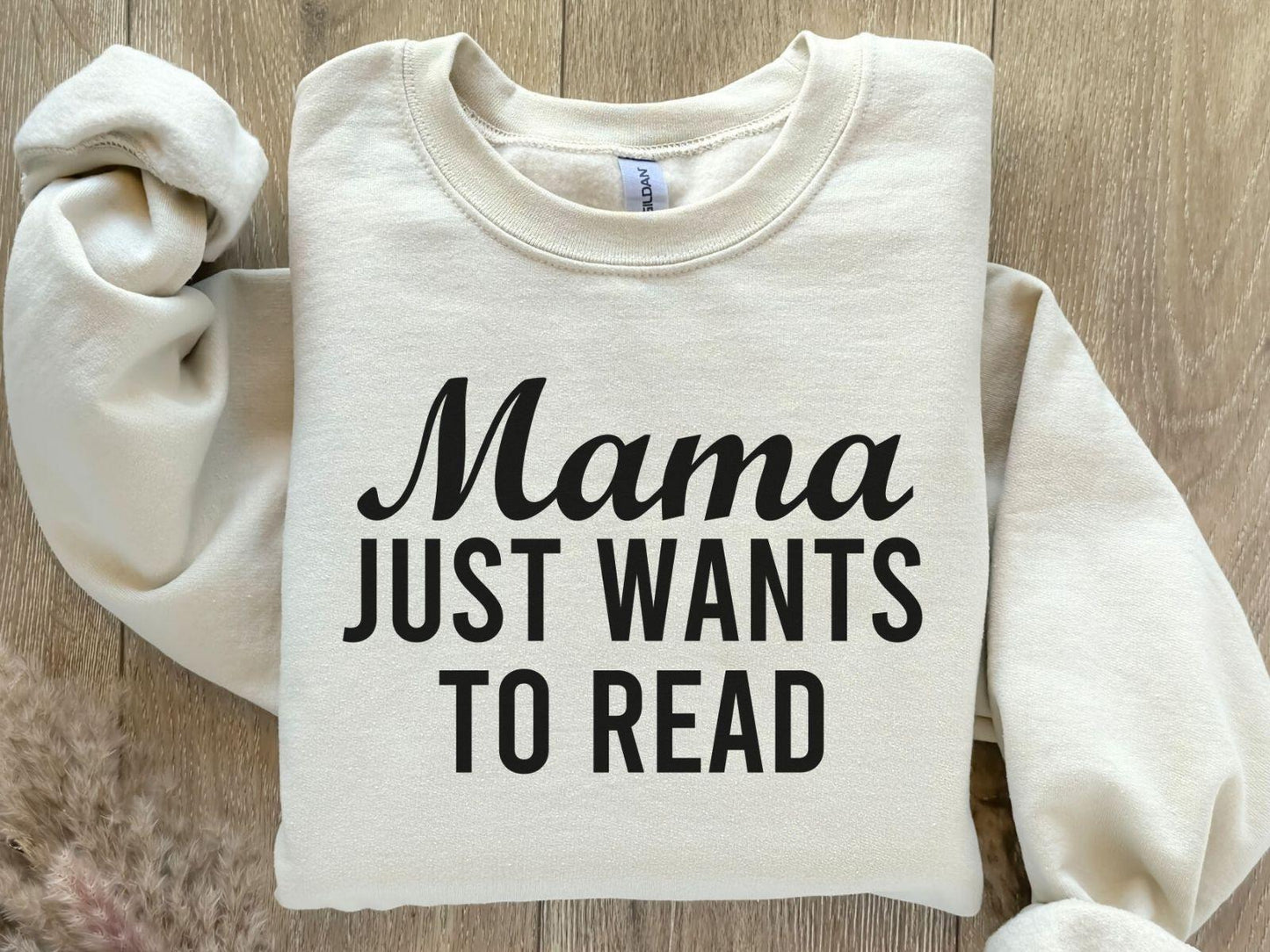 A Gildan 18000 sweatshirt with the saying "mama just wants to read"