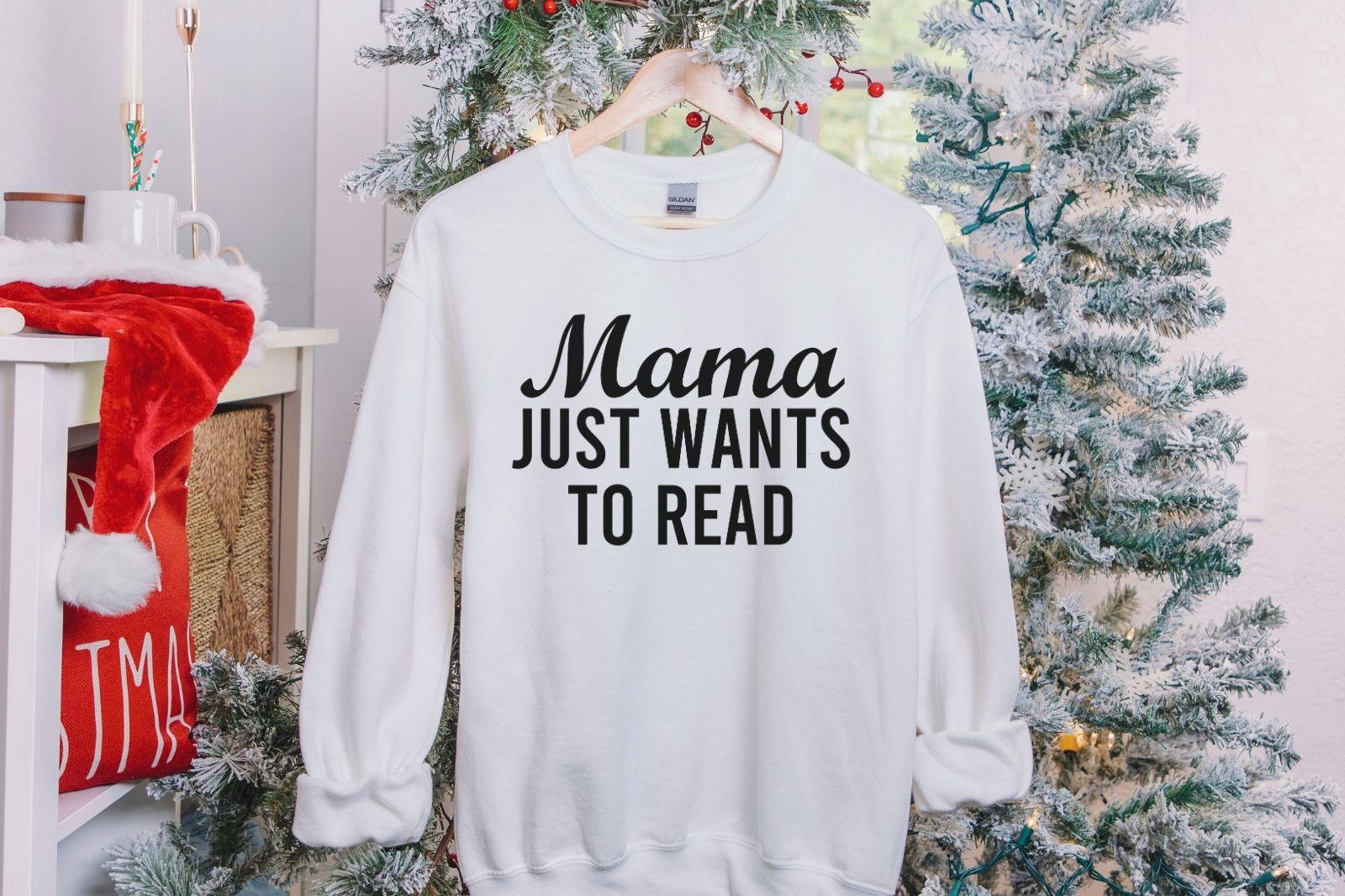 A Gildan 18000 sweatshirt with the saying "mama just wants to read"