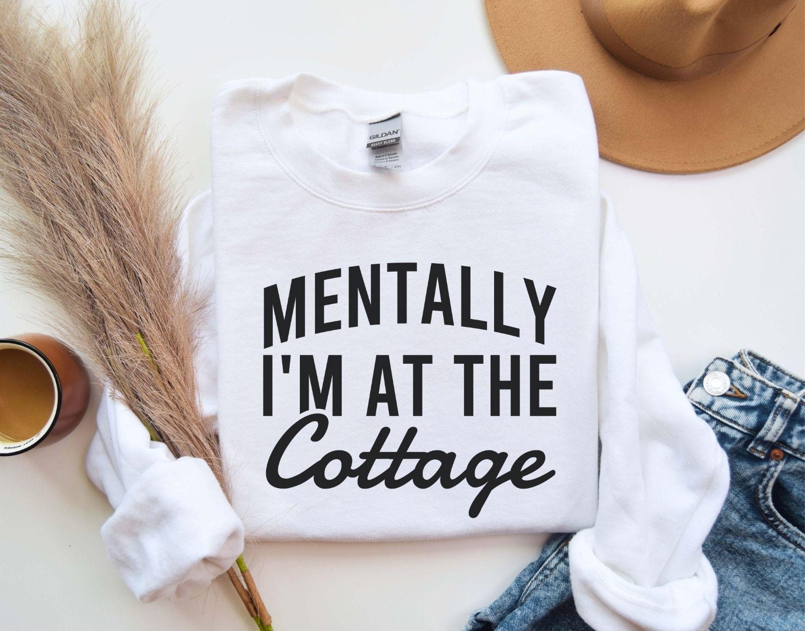 A Gildan 18000 sweatshirt with the saying "Mentally I'm at the cottage"