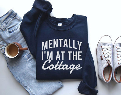 A Gildan 18000 sweatshirt with the saying "Mentally I'm at the cottage"