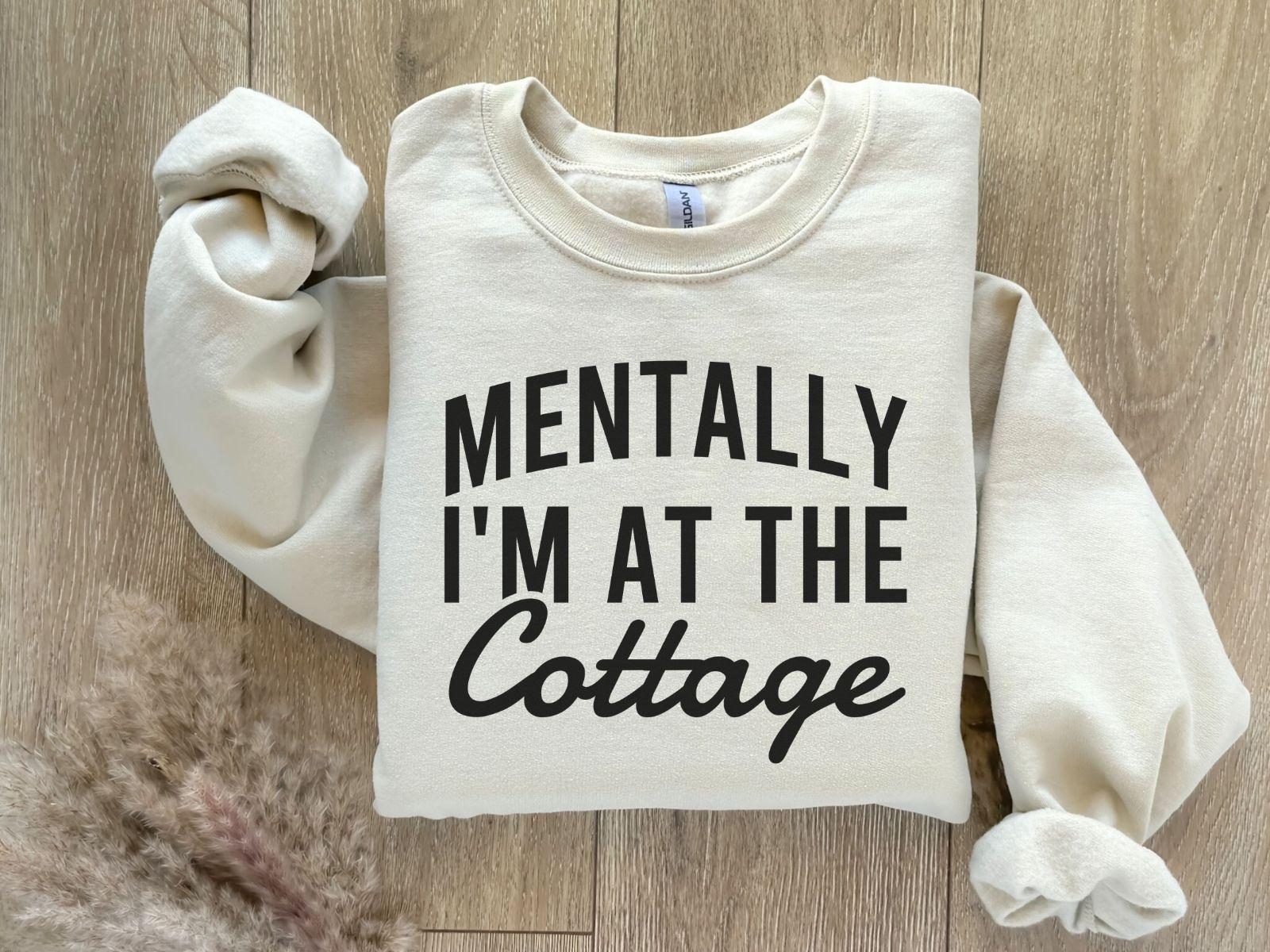 A Gildan 18000 sweatshirt with the saying "Mentally I'm at the cottage"