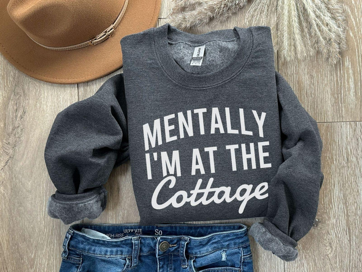 A Gildan 18000 sweatshirt with the saying "Mentally I'm at the cottage"