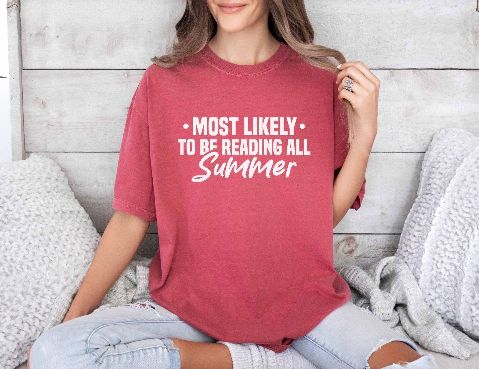 A comfort colors shirt with the saying "Most likely to be reading all summer"