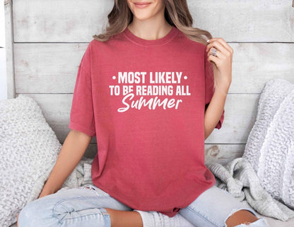 A comfort colors shirt with the saying "Most likely to be reading all summer"