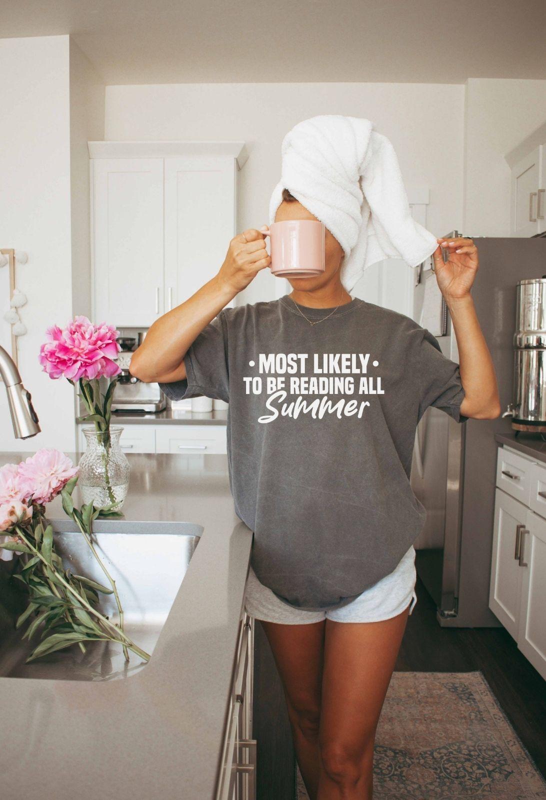 A comfort colors shirt with the saying "Most likely to be reading all summer"