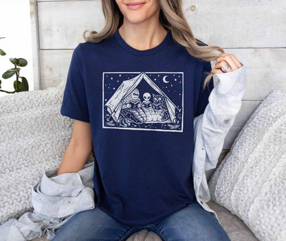 A bella canvas 3001 shirt with the saying "mothman, bigfoot and horned reading books"