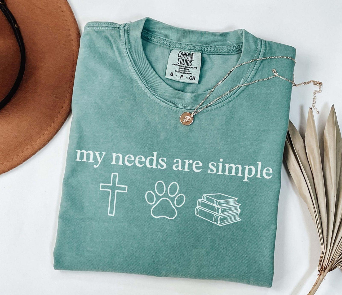 A comfort colors® shirt with the saying "my needs are simple"