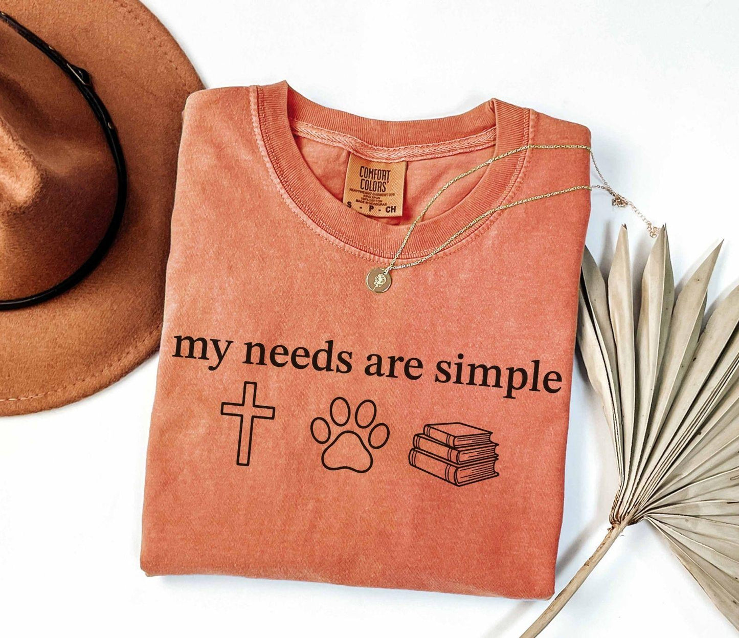 A comfort colors® shirt with the saying "my needs are simple"