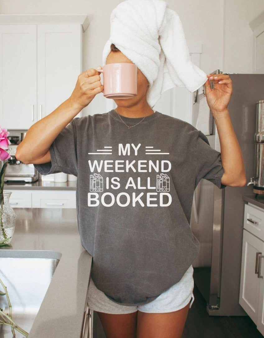 A comfort colors® shirt with the saying "My weekend is all booked"