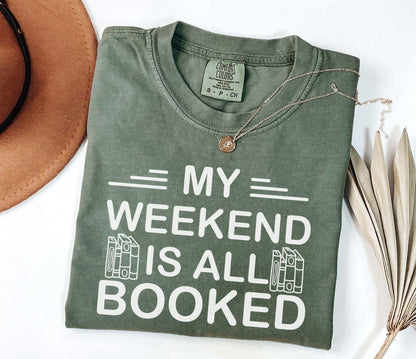 A comfort colors® shirt with the saying "My weekend is all booked"