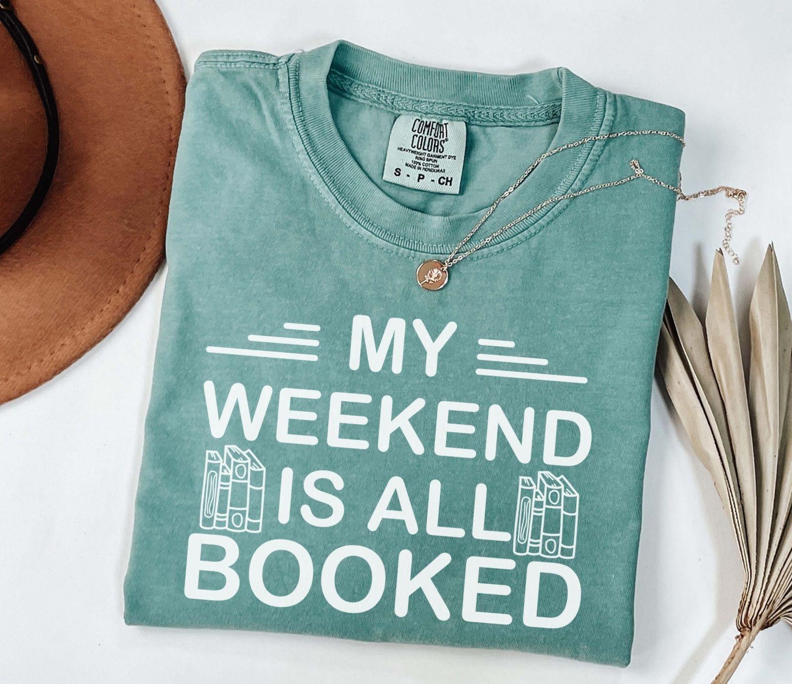 A comfort colors® shirt with the saying "My weekend is all booked"