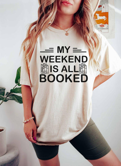 A comfort colors® shirt with the saying "My weekend is all booked"