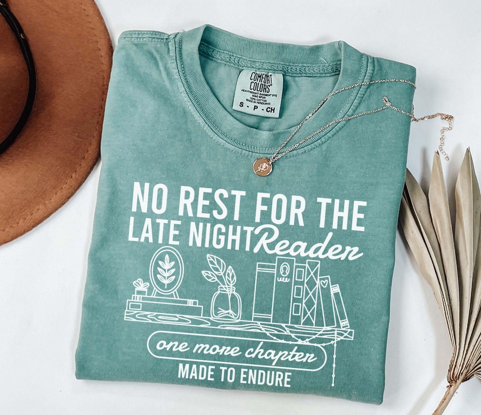 A comfort colors shirt with the saying "No rest for the late night readers one more chapter made to endure"