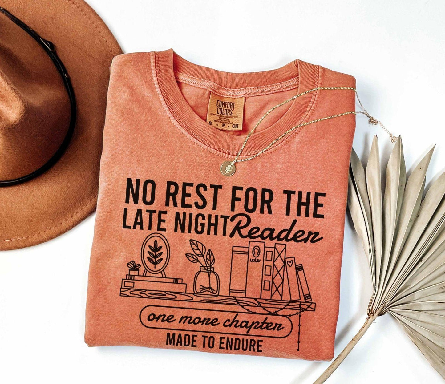 A comfort colors shirt with the saying "No rest for the late night readers one more chapter made to endure"