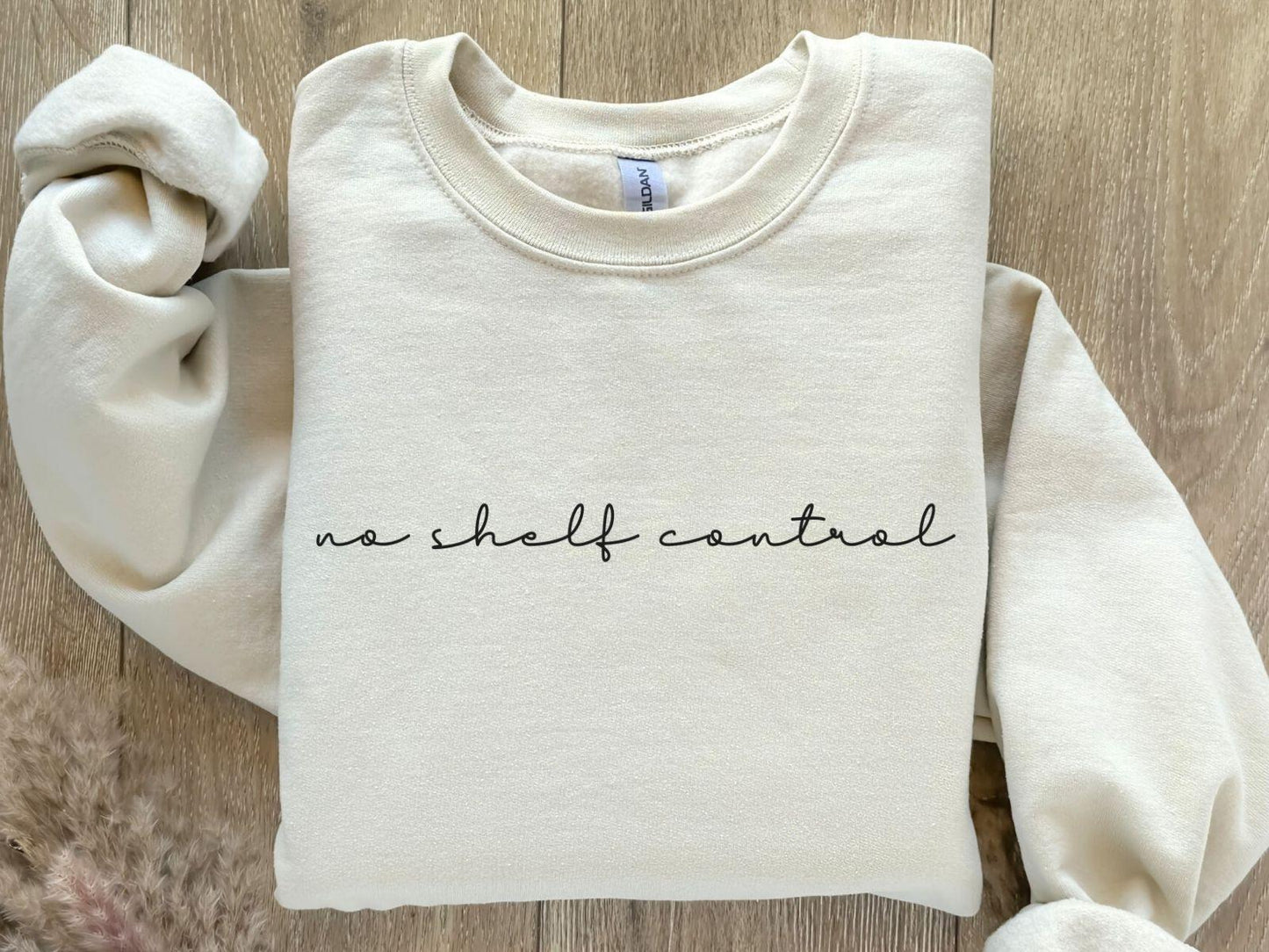 A Gildan 18000 sweatshirt with the saying "no shelf control"