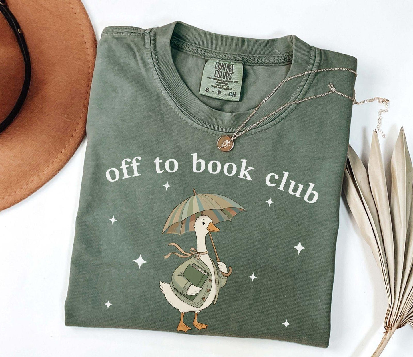 A comfort colors® shirt with the saying "off to book club"