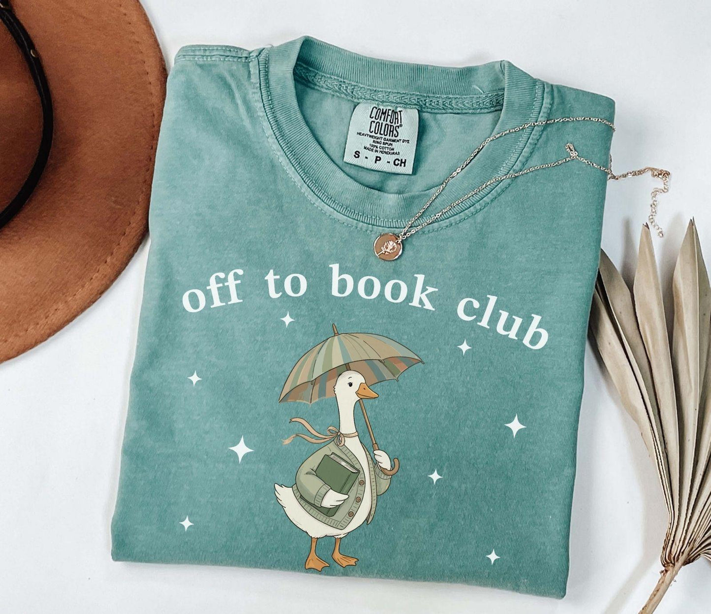 A comfort colors® shirt with the saying "off to book club"