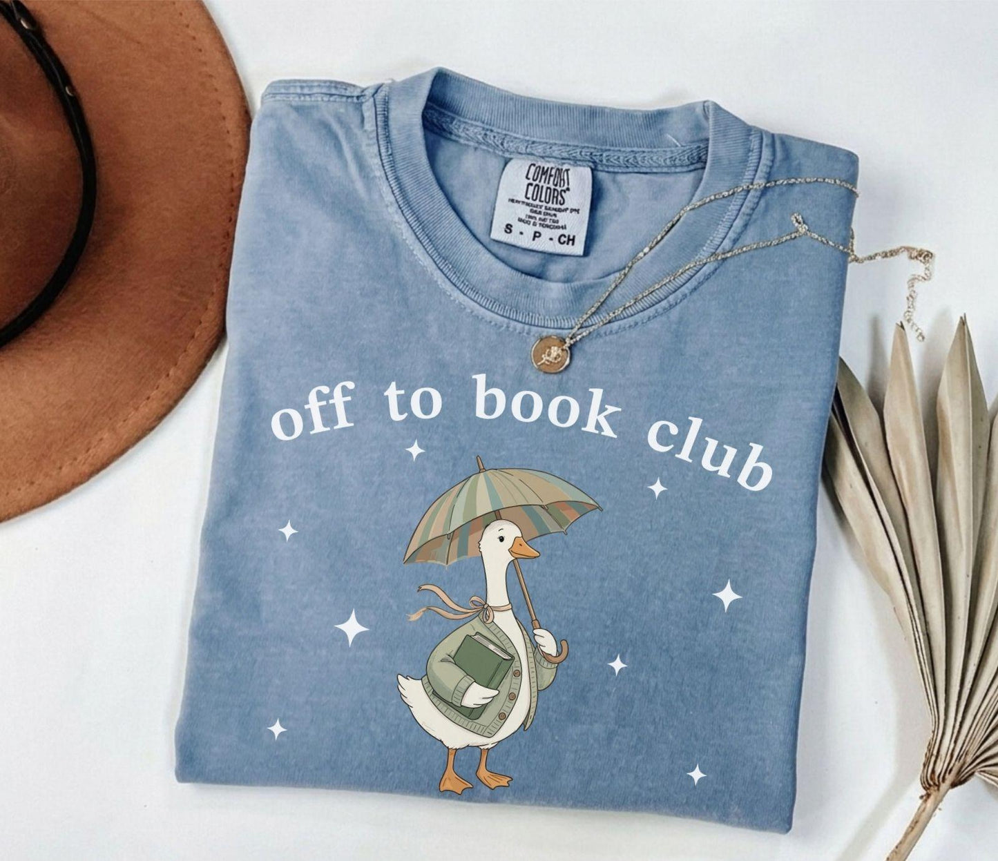 A comfort colors® shirt with the saying "off to book club"