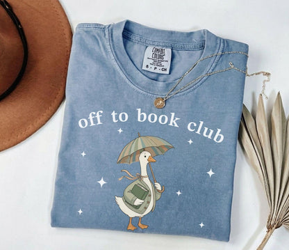 A comfort colors® shirt with the saying "off to book club"