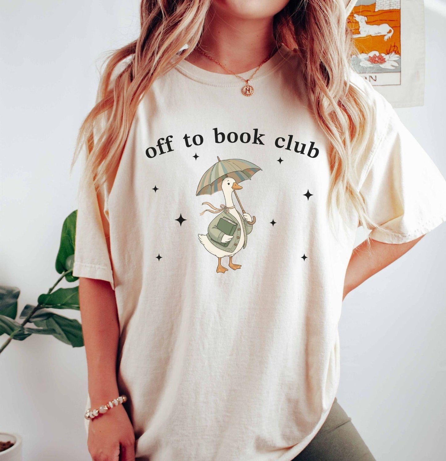 A comfort colors® shirt with the saying "off to book club"