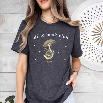 A bella canvas 3001 shirt with the saying "off to book club"
