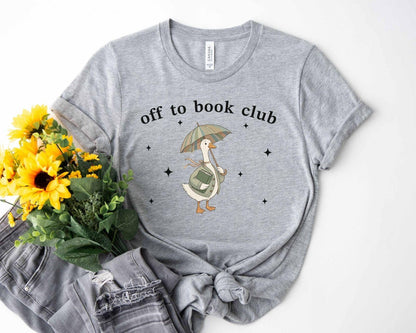 A bella canvas 3001 shirt with the saying "off to book club"