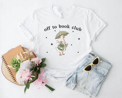 A bella canvas 3001 shirt with the saying "off to book club"