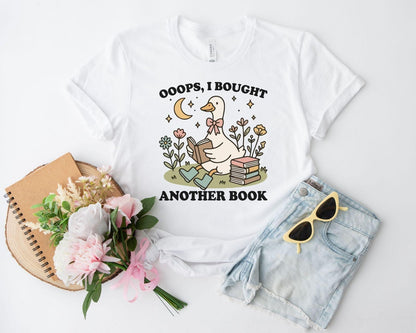 A bella canvas 3001 shirt with the saying "ooops I bought another book"