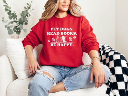 A gildan 18000 sweatshirt with the saying "Pet dogs read books be happy"