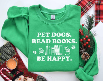 A gildan 18000 sweatshirt with the saying "Pet dogs read books be happy"