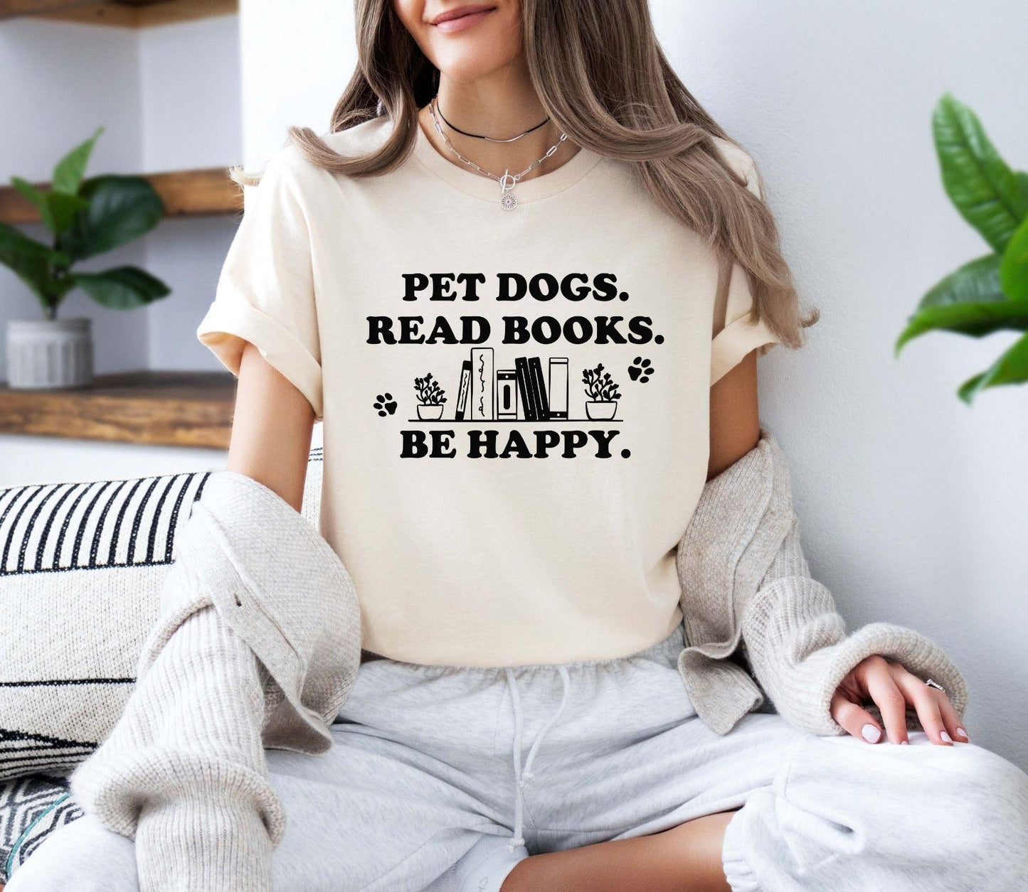 A gildan 18000 sweatshirt with the saying "Pet dogs read books be happy"