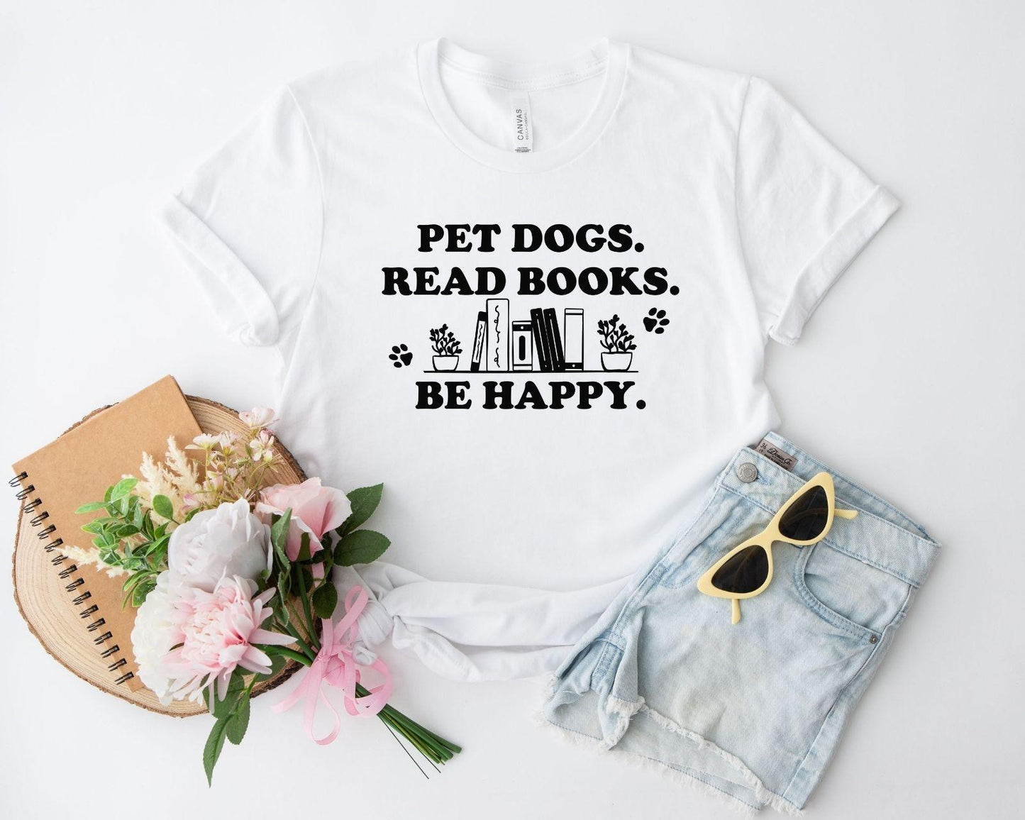 A gildan 18000 sweatshirt with the saying "Pet dogs read books be happy"