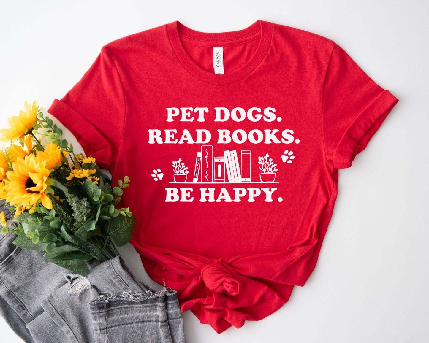A gildan 18000 sweatshirt with the saying "Pet dogs read books be happy"