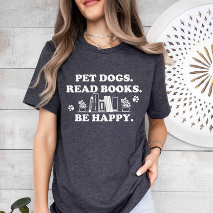 A gildan 18000 sweatshirt with the saying "Pet dogs read books be happy"