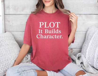 A comfort colors® shirt with the saying "Plot it builds character"