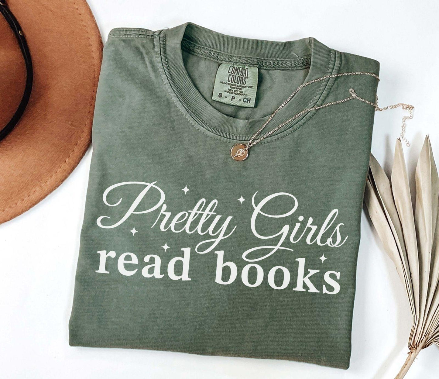 A comfort colors® shirt with the saying "Pretty girls read books"