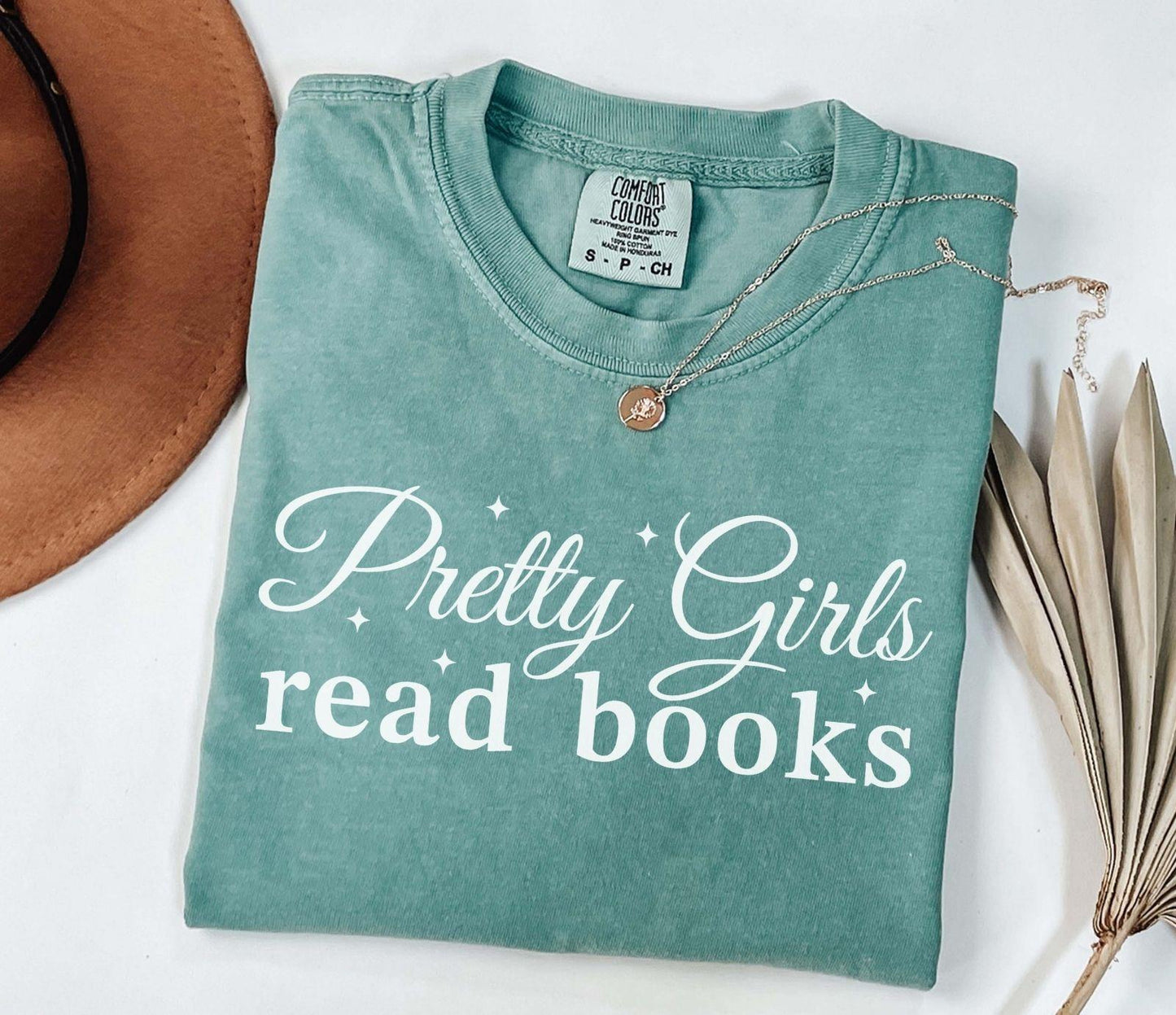 A comfort colors® shirt with the saying "Pretty girls read books"