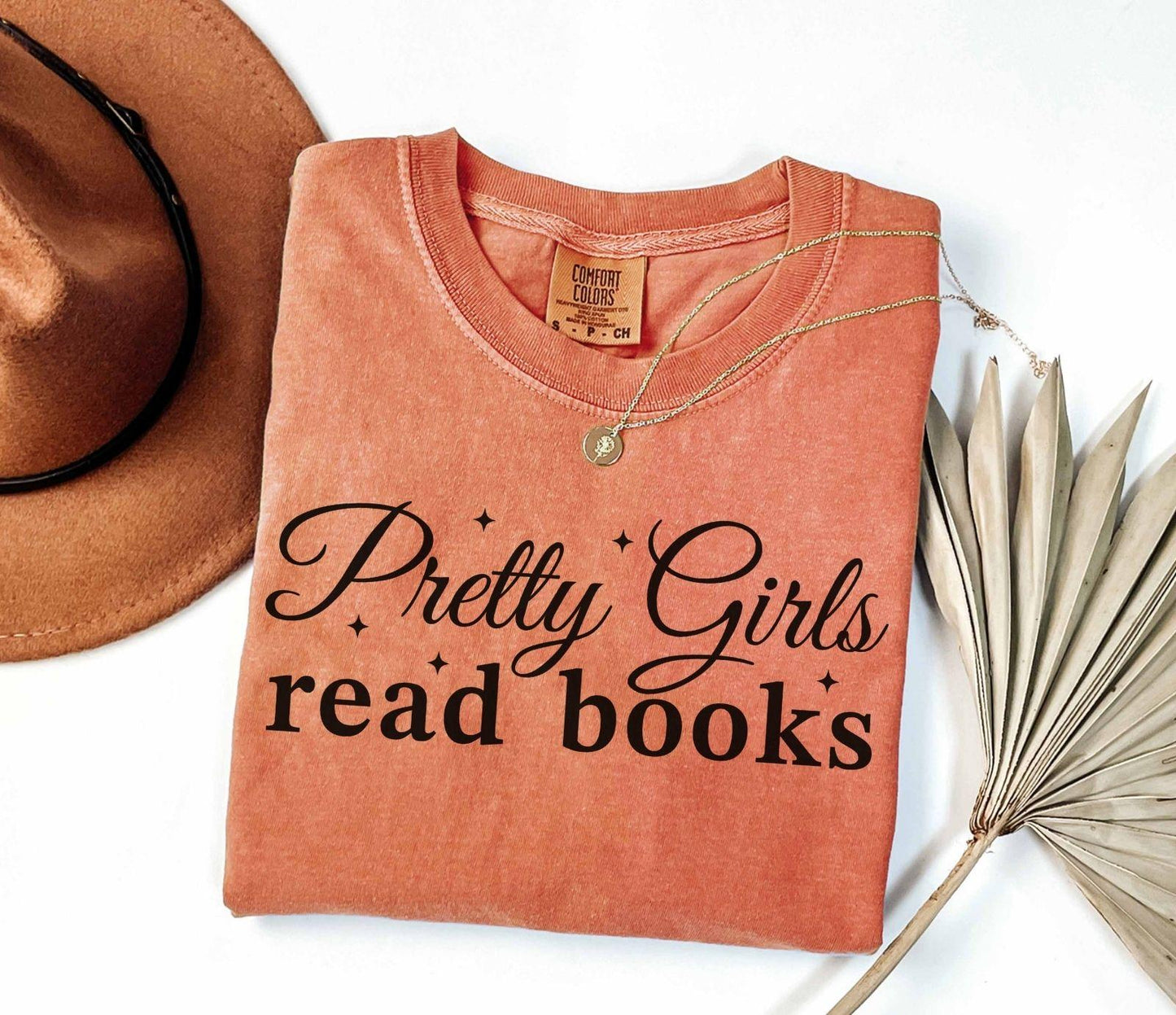 A comfort colors® shirt with the saying "Pretty girls read books"