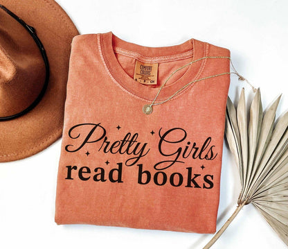 A comfort colors® shirt with the saying "Pretty girls read books"