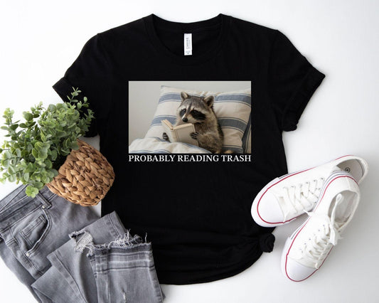 A bella canvas 3001 shirt with the saying "Probably reading trash"