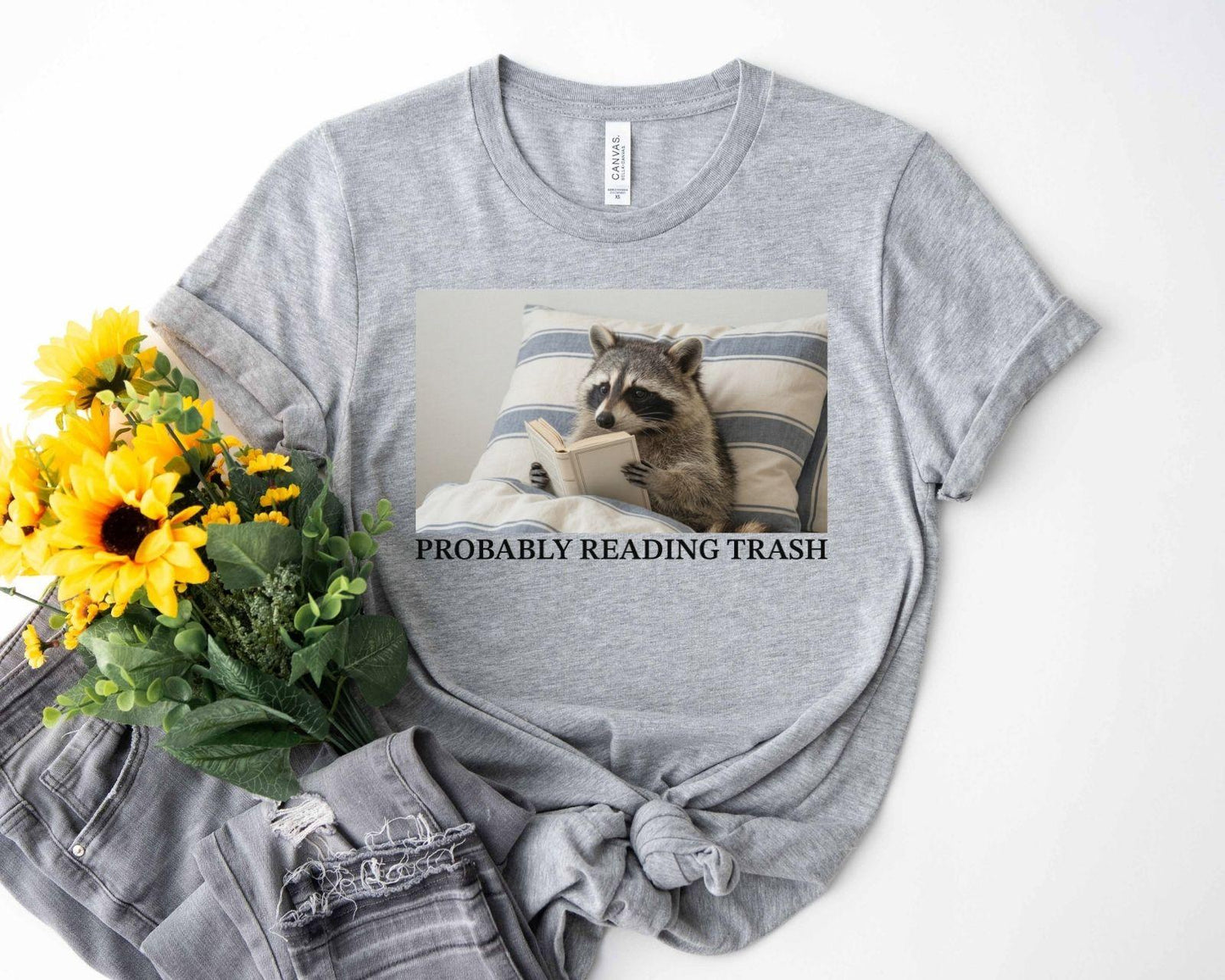 A bella canvas 3001 shirt with the saying "Probably reading trash"