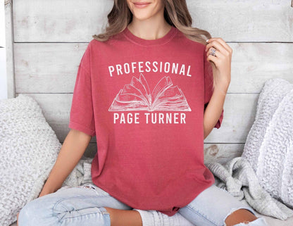 A comfort colors® shirt with the saying "Professional page turner"