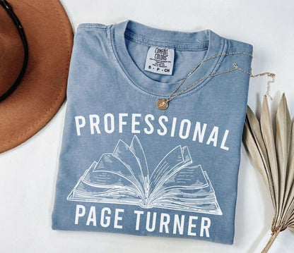 A comfort colors® shirt with the saying "Professional page turner"